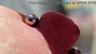 Close up of pierced nipples during a homemade video on the balcony