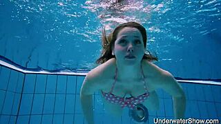 The sexy girl demonstrates her body in the water