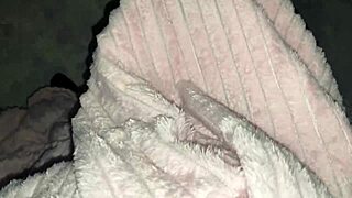 Stepdaughter warms up stepfather under the cozy blanket