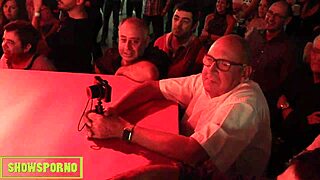 Entertaining performance featuring pornographic actors on a stage