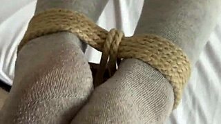 Bound slave submits to foot worship and domination