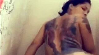 A mature woman of mixed race pleasures herself in the bathtub and reaches orgasm, covering herself in her own body fluids.