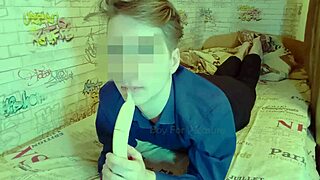 Muscular gay man shows off his deepthroating skills with a banana