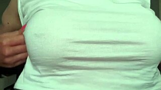 Busty amateur mom gets herself off by playing with her pierced nipples