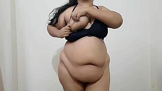 Beautiful big-breasted Indian MILF goes topless.