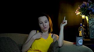 A brunette seductively blowing smoke and staring at you